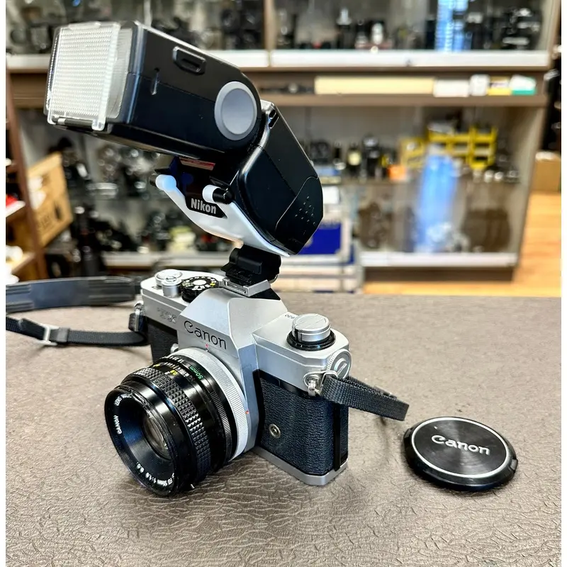 Canon TX 35mm Camera Body S# 304930 with Canon FD 50mm T1.8 Lens S# 1043116